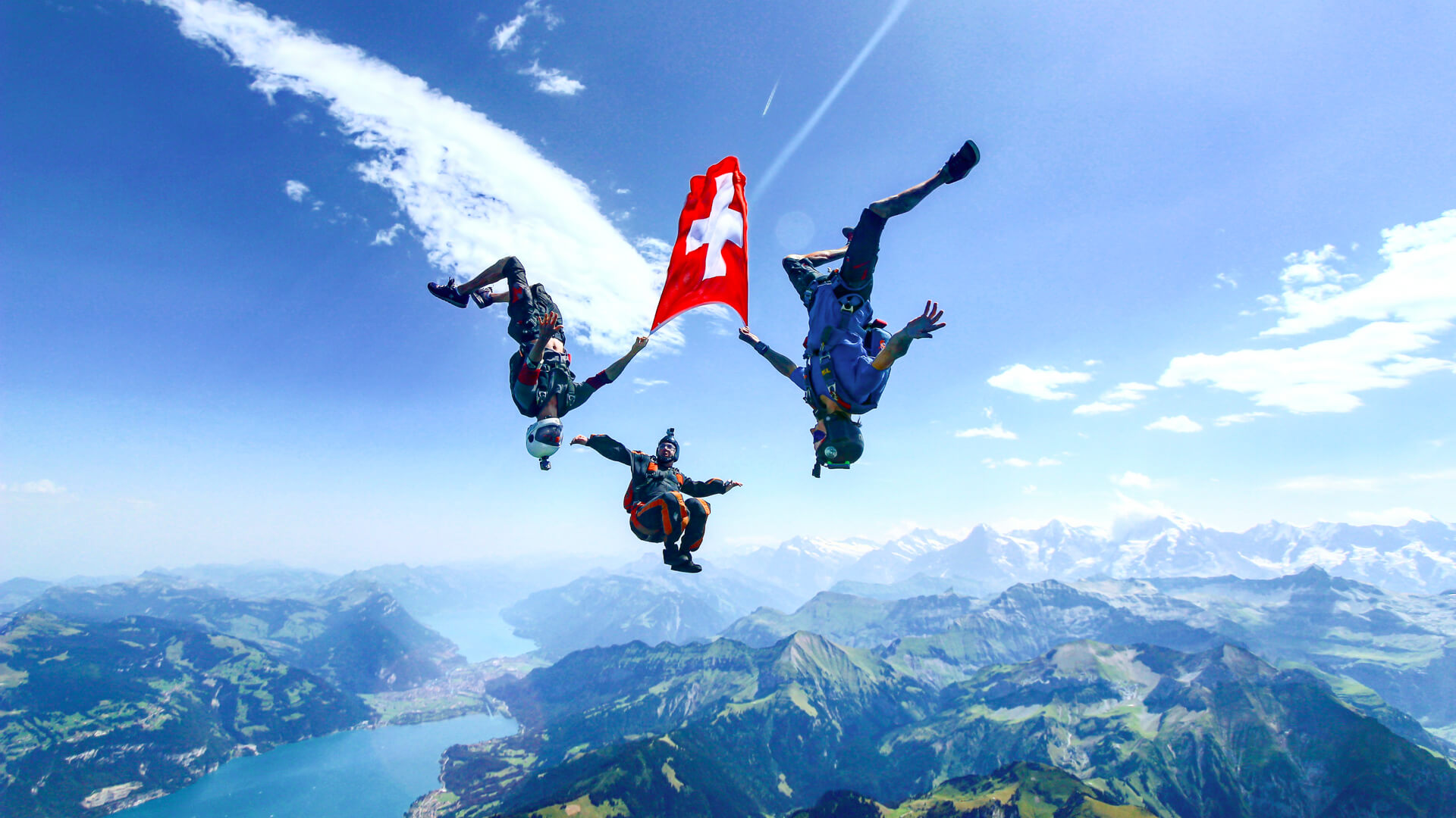 skydive-switzerland-fun-jumpers-swiss-flag-flying-1.jpg